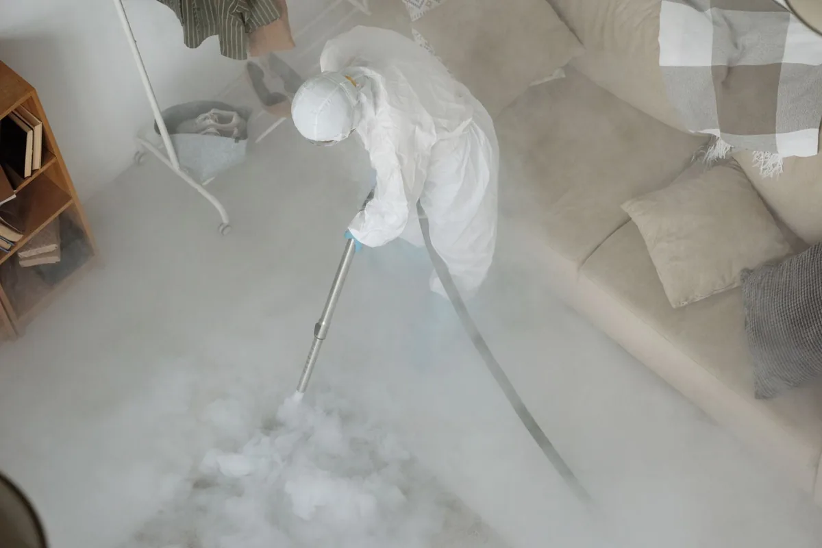 Biohazard cleanup technician in protective equipment, Shadyside, Pittsburgh, PA